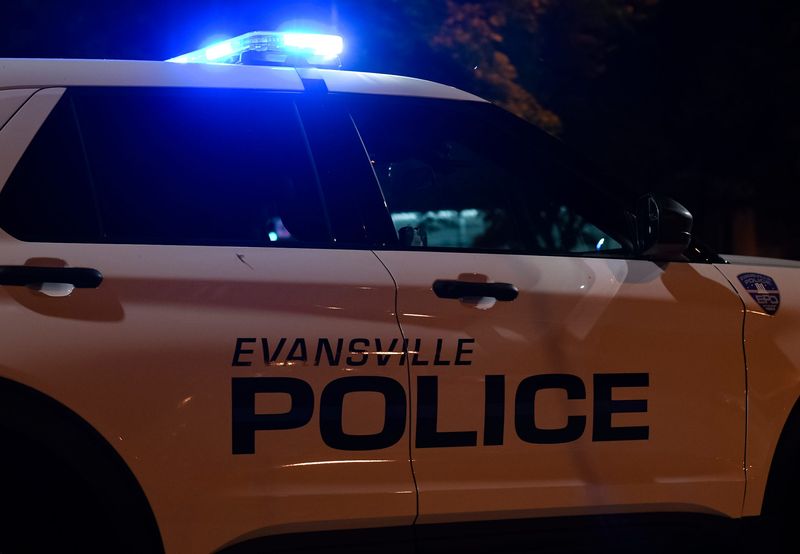 An Evansville Police Department cruiser with activated lights on patrol in Downtown Evansville July 23, 2023.