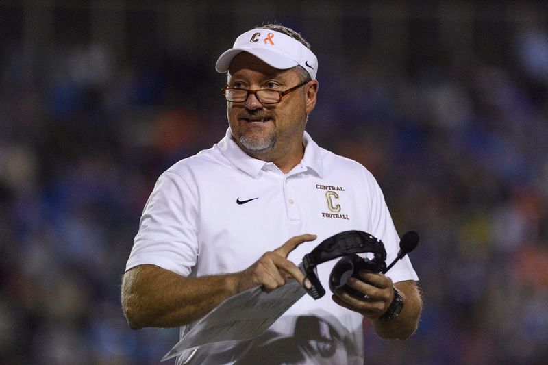 Central Head Coach Troy Burgess walks back to the sideline during the match against the Memorial Tigers at Central Stadium in Evansville, Ind., Friday, Sept. 28, 2018.