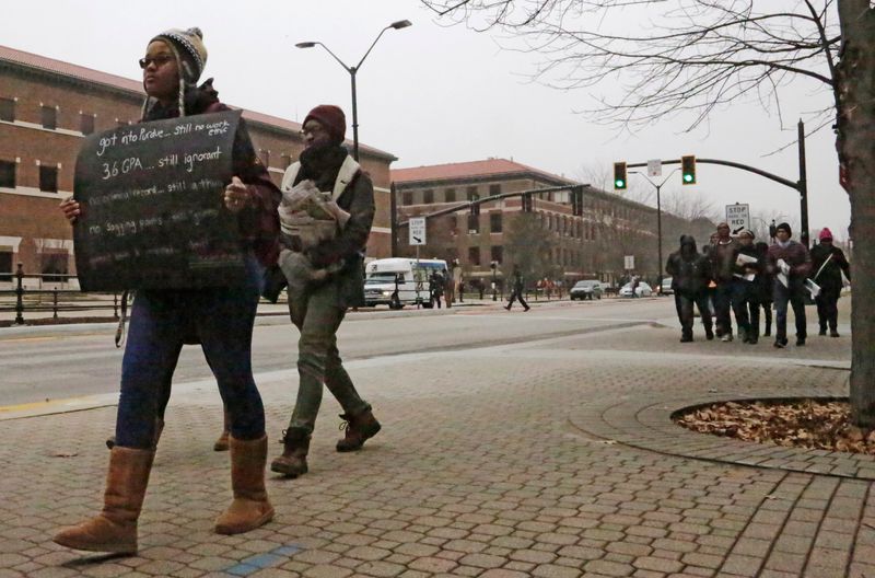 More than two dozen Purdue University students march, Friday, Dec. 12, 2014, to Hovde Hall of Administration on campus then to the nearby Purdue Exponent building in protest of multiple letters to the editor concerning race and justice issues published Dec. 11 by the Exponent.