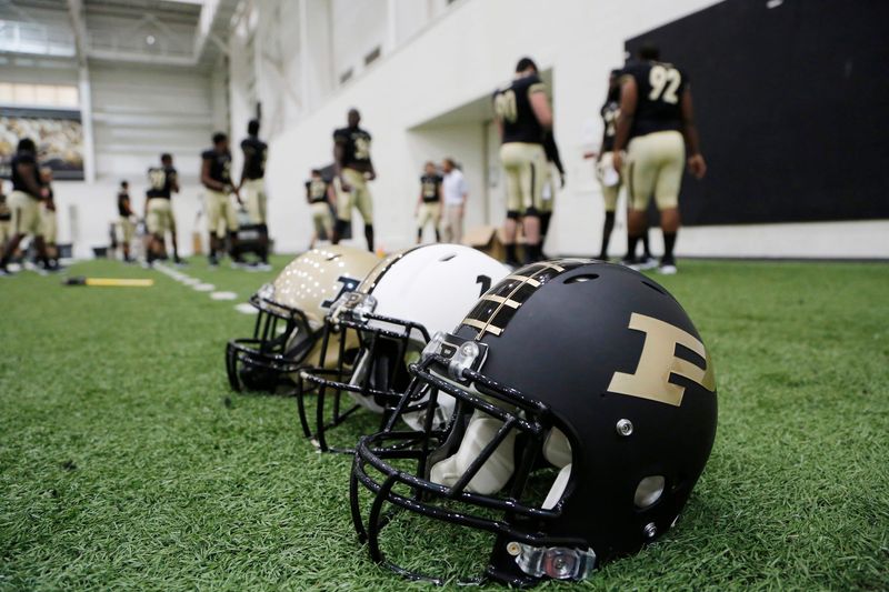 Three of the helmets that will be worn this season are displayed inside the Mollenkopf Athletic Center for Purdue football media day Sunday, August 9, 2015, on the campus of Purdue University in West Lafayette.