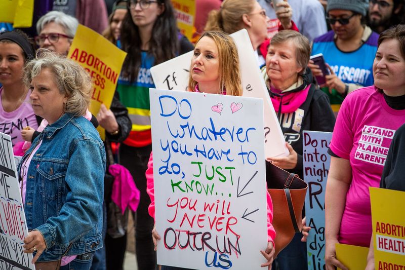 Reproductive health supporters gather at the Indiana Statehouse for a 'Stop the Bans' rally against extreme abortion bans on Tuesday, May 21, 2019. The Indiana rally is just one of hundreds being held simultaneously across the country.
