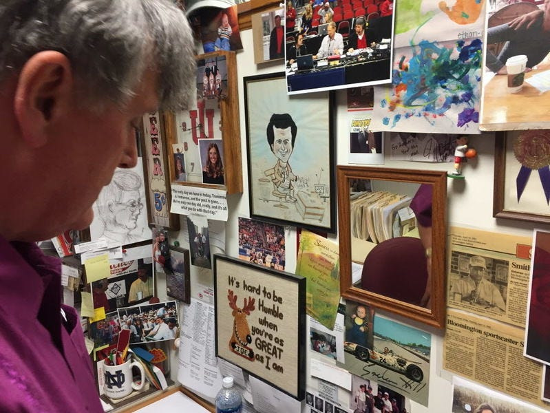 Veteran broadcaster Joe Smith looks over some of the memorabilia that covers his office at WGLC radio. Smith is in his 48th year in broadcasting, but his first since returning from a near-fatal fall in May 2017.