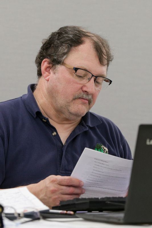 Rocky Hession, Fairfield Township board member, looks over a document during a meeting of township board, Tuesday, Aug. 10, 2021 at Plumbers & Pipefitters Local Union 157 in Lafayette.