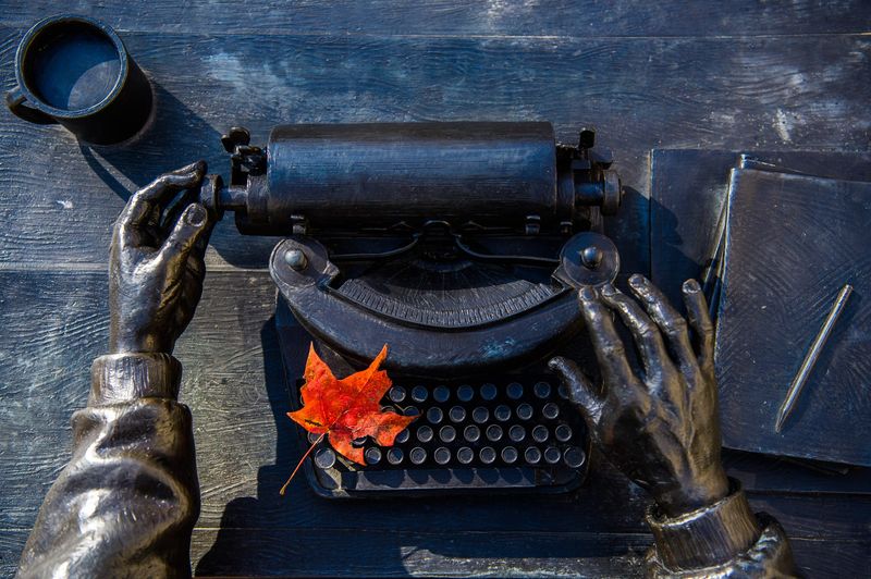A red leaf rests on the keys of the the Ernie Pyle statue Nov. 3 in front of the Media School on the Indiana University campus.