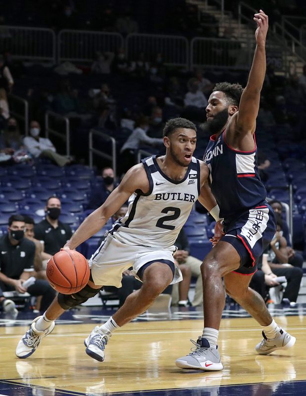 Connecticut Huskies guard R.J. Cole (1) guards Butler Bulldogs guard Aaron Thompson (2) as he drives toward the basket during the second half of the game Saturday, Jan. 9, 2021, at Hinkle Fieldhouse in Indianapolis. Connecticut won, 72-60.