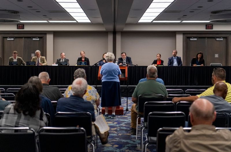 Sister Mary Rogers, center, addresses the Indiana Utility Regulatory Commission during a hearing to receive public comments on the latest CenterPoint rate increase request at the Old National Events Plaza in Evansville, Ind., Wednesday, Sept. 13, 2023.