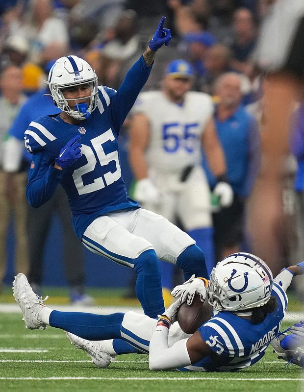 Indianapolis Colts safety Rodney Thomas II (25) reacts as cornerback Kenny Moore II (23) makes an interception during the second half of the game against the Los Angeles Rams on Sunday, Oct. 1, 2023, at Lucas Oil Stadium in Indianapolis. The Colts lost in overtime, 29-23.
