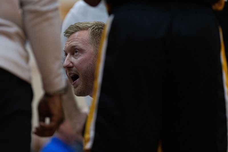 Avon Orioles head coach Drew Schauss talks with his team during a timeout Jan 5, 2024, at Plainfield High School in Plainfield, Indiana.