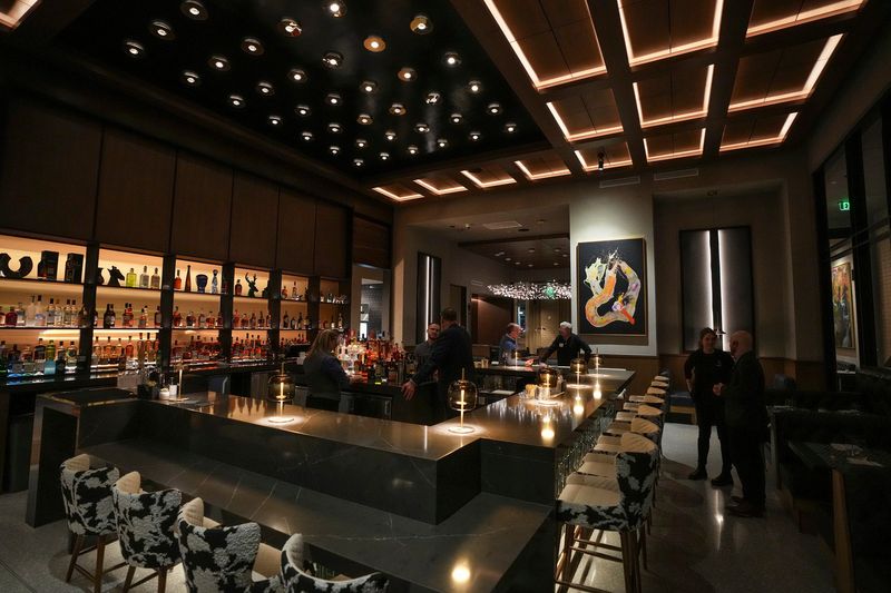 The main bar Wednesday, Jan. 17, 2024, during a preview event for Commission Row, a new restaurant, bar and event space near Gainbridge Fieldhouse in downtown Indianapolis.