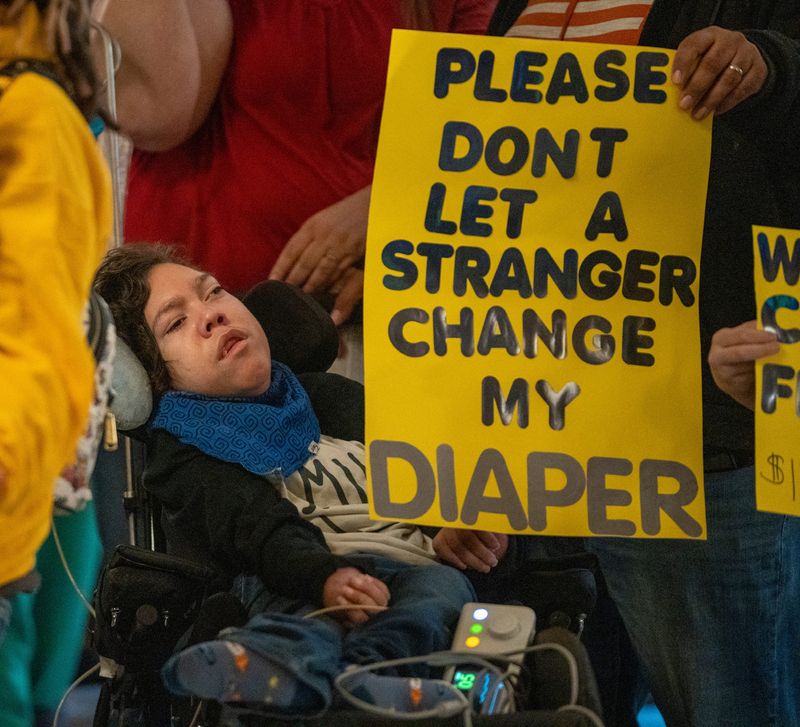 Isaac Suero, 13, of Ft. Wayne, with his family on Monday, Jan. 22, 2024, at the Indiana Statehouse. About 100 people showed up for a rally who are at odds with a recent Family and Social Services Administration decision to eliminate financial reimbursement for family members who care for severely disabled and medically complex children.