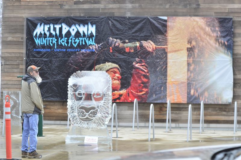 A festivalgoer admires one of the many ice sculptures on display at Jack Elstro Plaza during the 2024 Richmond Meltdown Winter Ice Festival, Saturday, Jan. 27.