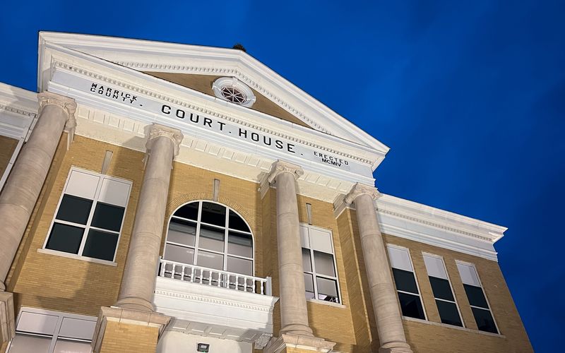 The Warrick County Courthouse as seen against a dark blue sky Monday, Feb. 13, after commissioners Terry Phillippe, Dan Saylor and Robert Johnson hosted the first regular commission meeting since their arrests on Feb. 8.