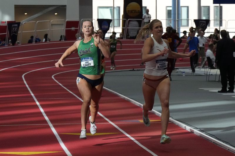 Mar 8, 2024; Boston, MA, USA; Jadin O'Brien of Notre Dame (left) and Kristine Blazevica of Texas run in the pentathlon 800m during the NCAA Indoor Track and Field Championships at The Track at New Balance. Mandatory Credit: Kirby Lee-USA TODAY Sports