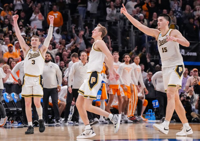 Purdue Boilermakers guard Braden Smith (3), Purdue Boilermakers guard Fletcher Loyer (2) and Purdue Boilermakers center Zach Edey (15) celebrate in the final seconds of the game against the Tennessee Volunteers on Sunday, March 31, 2024, during the Midwest Regional championship game at Little Caesars Arena in Detroit. The Purdue Boilermakers defeated the Tennessee Volunteers to move on to the Final Four game in Phoenix, Arizona.