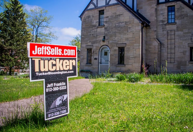 A for sale sign in front of house on Wednesday, April 24, 2024.