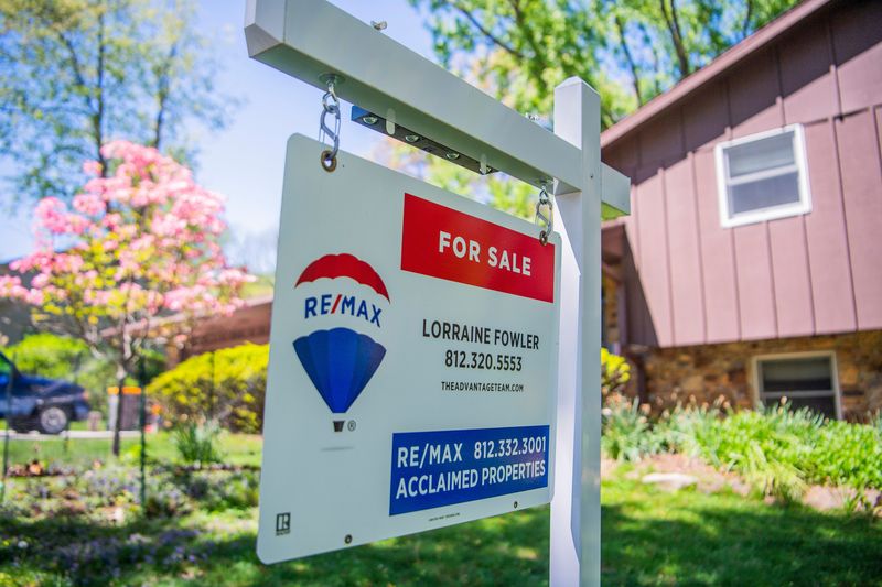 A for sale sign in front of house on Wednesday, April 24, 2024.