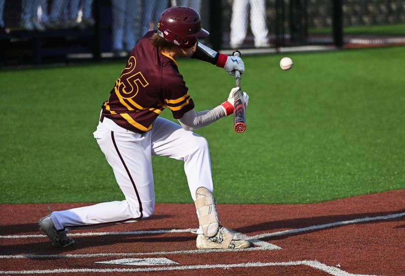 Bloomington North’s Liam Smith hits a sacrifice bunt to score Luke Freel during the baseball game at South on Thursday, April 25, 2024.