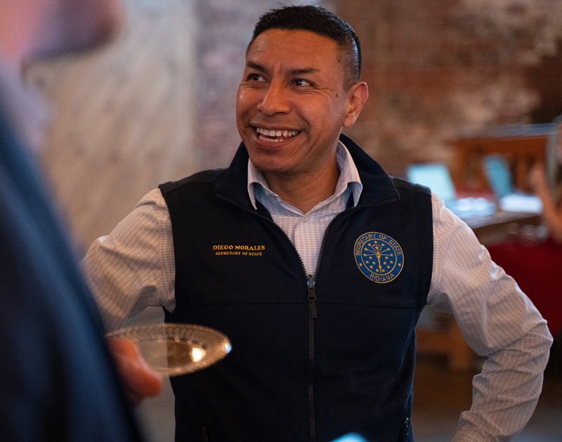 Indiana Secretary of State Diego Morales mingles with guests at the watch party for gubernatorial candidate Suzanne Crouch, May 7, 2024, at The Industry in Indianapolis, Indiana.