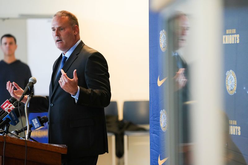 Pat Knight, Marian University’s new men’s basketball head coach, speaks at the podium during a press conference, Friday, May 10, 2024, in the Peyton Manning Children’s Hospital Hall of Champions at Marian University in Indianapolis.