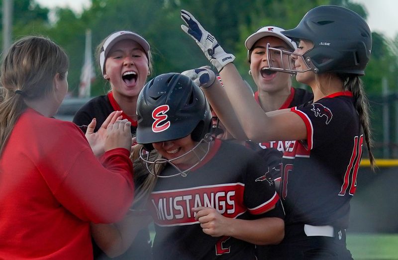 Edgewood's Madi Bland (2) is congratulated by her teammates after hitting a walk-off home run during the softball game against Indian Creek at Edgewood on Monday, May 13, 2024.
