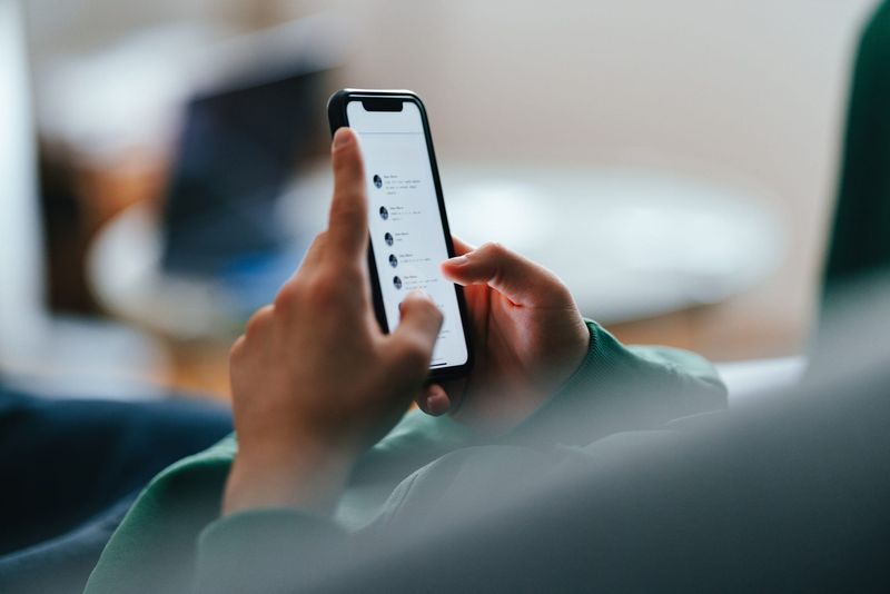 Texting on a cellphone.