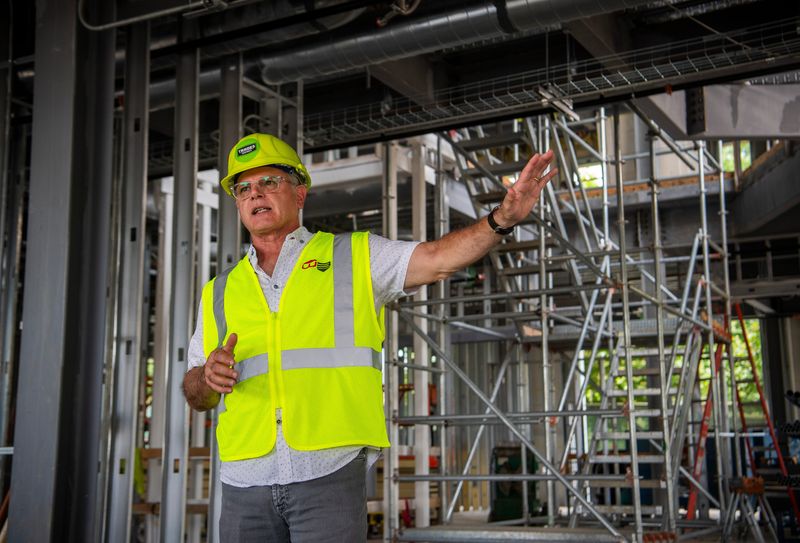 John Fernandez, then senior vice president of innovation and strategic partnerships at The Mill, discusses The Forge, a new tech center, across from The Mill on North Madison Street on Tuesday, June 26, 2024.
