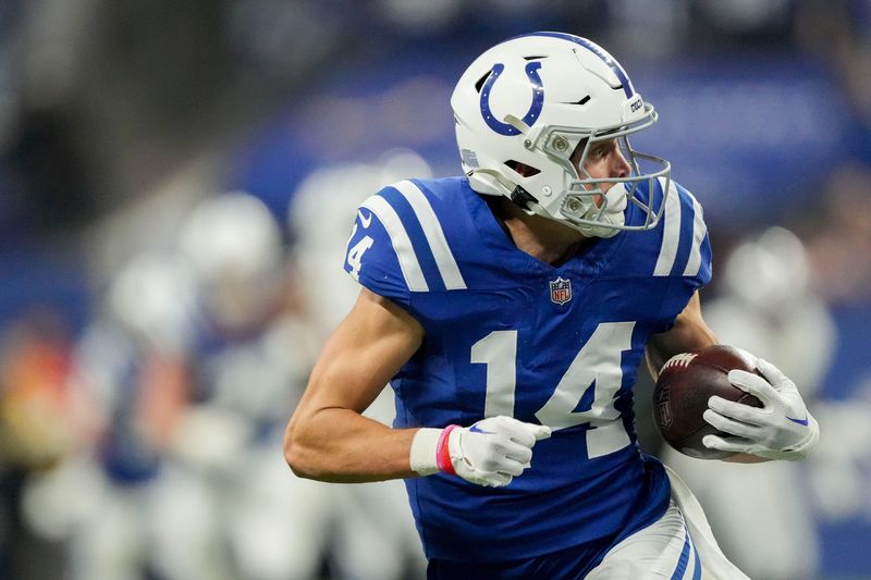 Indianapolis Colts wide receiver Alec Pierce (14) looks back as he runs to the end zone for a touchdown Sunday, Dec. 31, 2023, during a game against the Las Vegas Raiders at Lucas Oil Stadium in Indianapolis.