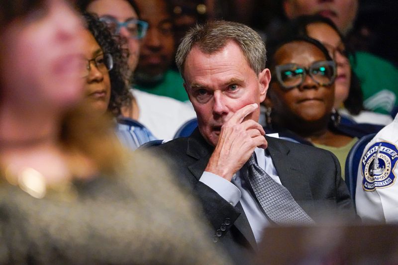 Lauren Roberts who along with 2 other women made sexual harassment allegations against Indianapolis Mayor Joe Hogsett’s former chief of staff Thomas Cook, listen as Mayor Joe Hogsett apologizes to them during a City-County Council meeting on Monday, Aug. 12, 2024, in Indianapolis.