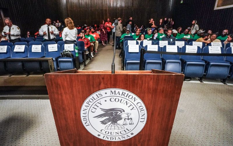 Attendees filter into watch a City-County Council meeting on Monday, Aug. 12, 2024, in Indianapolis.