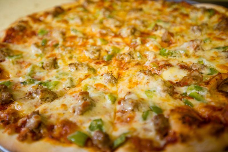 Try out pizza from one of the food trucks in the Ball Band Biergarten on June 27, 2025.