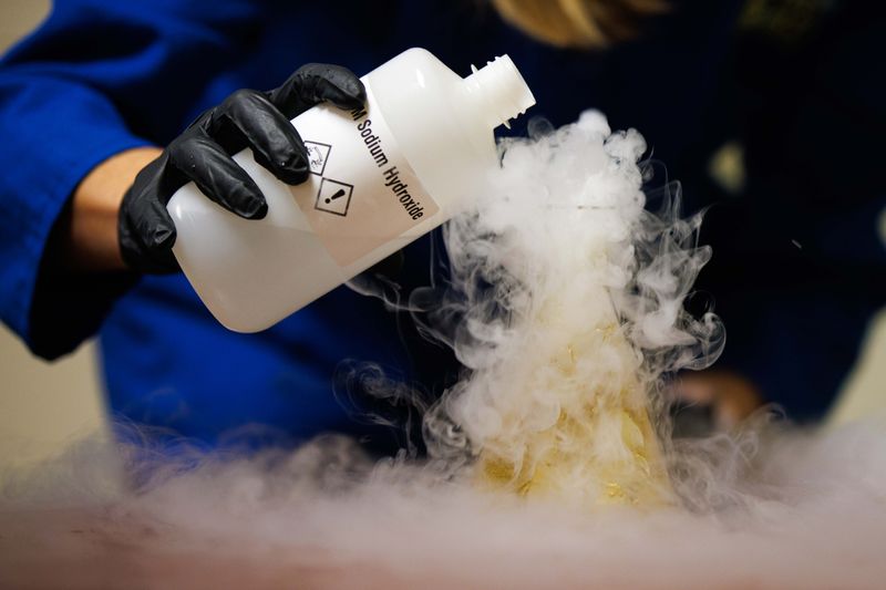 University of Notre Dame Professor for the Public Understanding of Science Kate Biberdorf, known as "Kate the Chemist," performs an experiment in her office at Stepan Chemistry Hall on Tuesday, Sept. 10, 2024, in South Bend.
