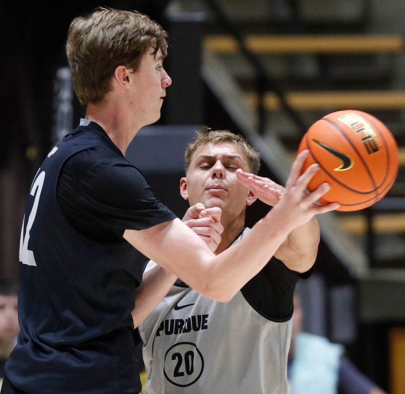 Purdue Boilermakers Daniel Jacobsen (12) is defended by Purdue Boilermakers forward Josh Furst (20) Monday, Sept. 23, 2024, during basketball practice at Mackey Arena in West Lafayette, Ind.