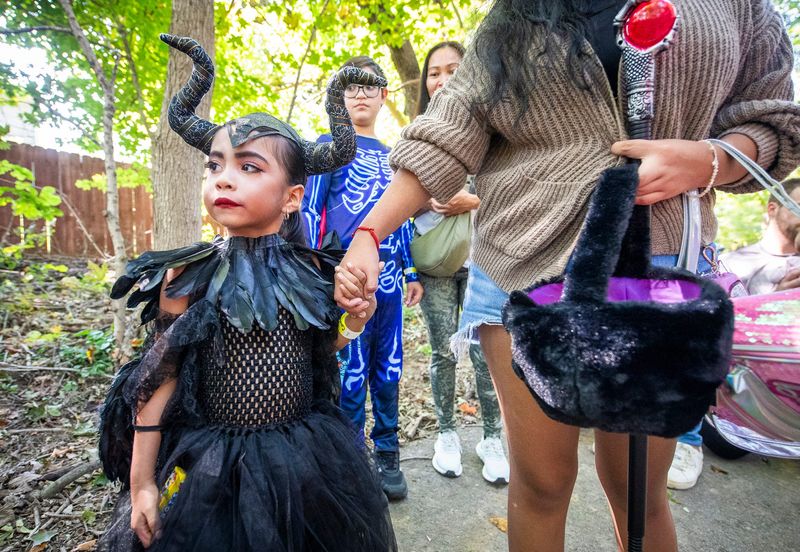 Dressed as Maleficent, Zoe Montano walks on the Trick or Treat Trail at RCA Community Park on Saturday, Oct. 5, 2024.