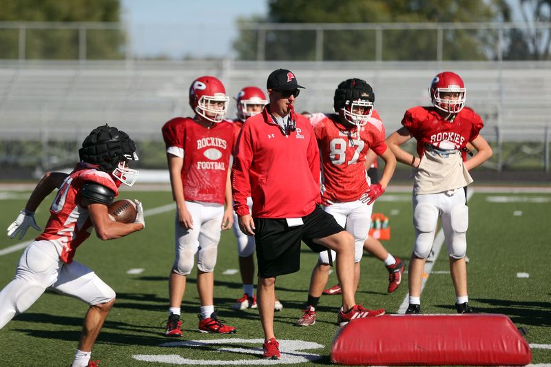 Plymouth High School football head coach Adam Handley, middle, looks on during a drill in practice Tuesday, Oct. 8, 2024. Handley has led a Rockies resurgence in his third year leading the program, putting themselves in the discussion for NLC and sectional hardware.