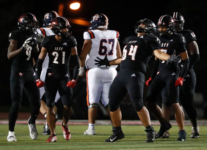 Lafayette Jeff Bronchos Diego Garcia (64) celebrates after a defensive stop Friday, Oct. 11, 2024, during the IHSAA football game against the Harrison Raiders at Lafayette Jeff High School in Lafayette, Ind. Lafayette Jeff won 45-21.