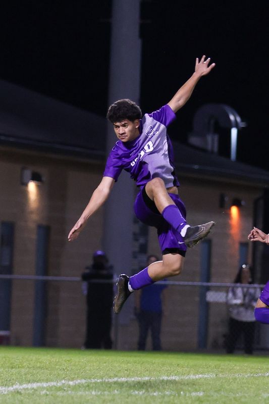 Ben Davis Elvin Rivera (20) goes into the air looking to block a shot as Ben Davis took on Pike High School in the S11 IHSAA Class 3A Boys Soccer State Tournament, Oct 12, 2024; Avon, IN]; at Avon High School.