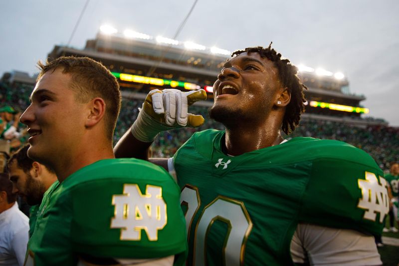 Notre Dame defensive lineman Bryce Young, right, celebrates after winning a NCAA college football game 31-24 between Notre Dame and Louisville at Notre Dame Stadium on Saturday, Sept. 28, 2024, in South Bend.