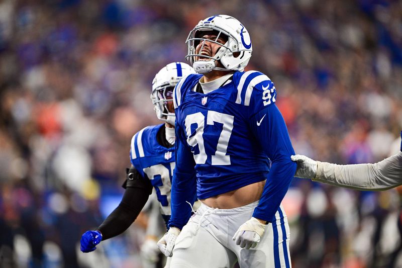 Sep 22, 2024; Indianapolis, Indiana, USA; Indianapolis Colts defensive end Laiatu Latu (97) celebrates a sack during the second half against the Chicago Bears at Lucas Oil Stadium. Mandatory Credit: Marc Lebryk-Imagn Images