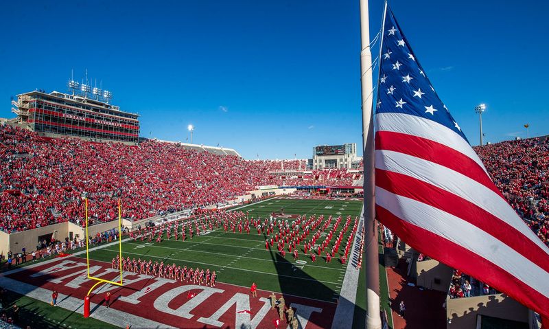 The national anthem is played as the flag is raised before the start of the Indiana versus Washington football game at Memorial Stadium on Oct. 26, 2024.