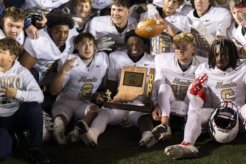 Decatur Central High School players celebrate winning an IHSAA class 5A sectional championship football game against Plainfield High School, Friday, Nov. 8, 2024, at Plainfield High School. Decatur Central won 35-7.