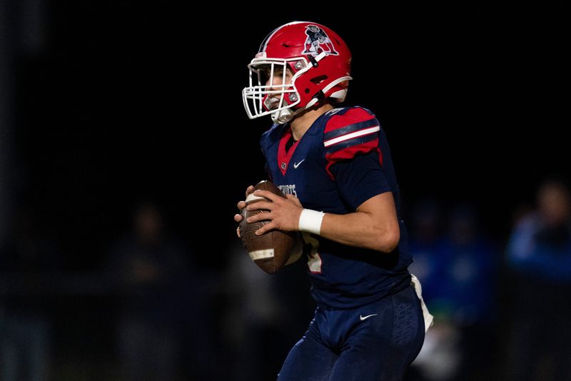 Heritage Hills' Jett Goldsberry (3) looks to pass as the Heritage Hills Patriots play the Memorial Tigers in the IHSAA Class 3A sectional championship at Heritage Hills High School in Lincoln City, Ind., Friday, Nov. 8, 2024.