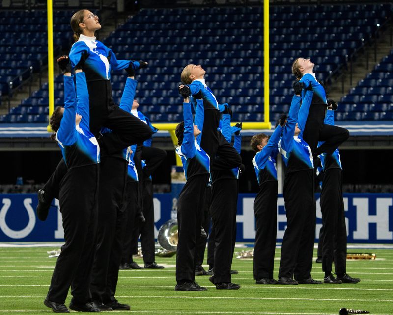 The NorthWood Red Regiment performs Saturday, Nov. 9, 2024, during the 51st Indiana State School Music Association marching band state finals at Lucas Oil Stadium in Indianapolis.