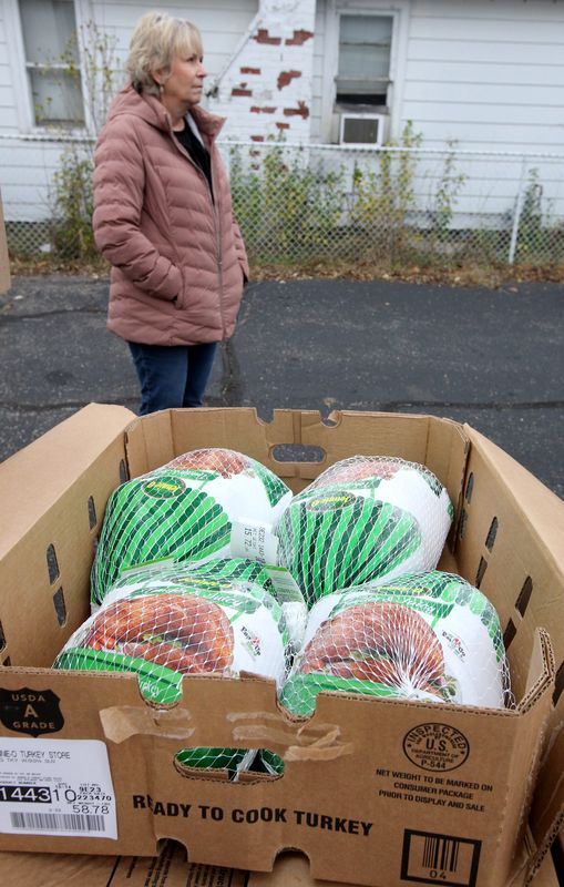 Volunteer Kim Kollar stands near the box of frozen turkeys Monday, Nov. 11, 2024, at a turkey distribution site at Twin Branch Bible Church in Mishawaka. The Food Bank of Northern Indiana has several upcoming turkey giveaway drives scheduled throughout Northern Indiana in the coming weeks as part of its and WNDU-TV's annual Turkeys on the Table Challenge.