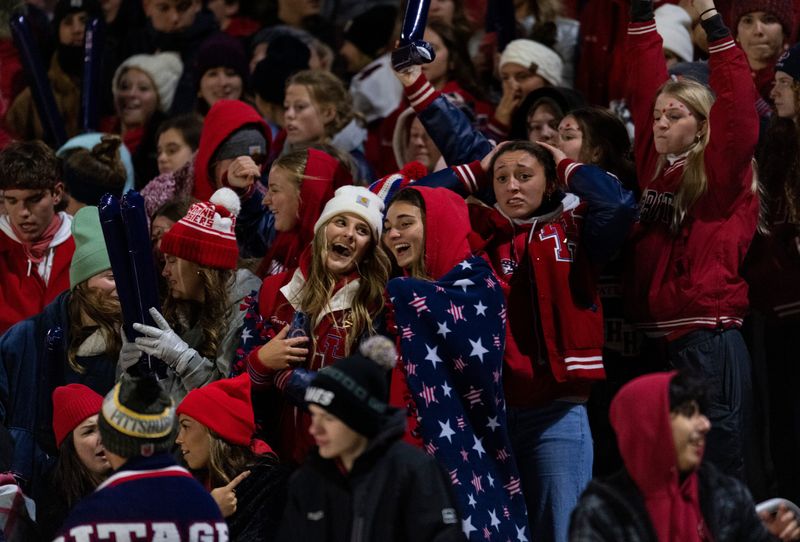 The student section cheers after a touchdown as the Heritage Hills Patriots play the Batesville Bulldogs during the IHSAA Class 3A football semistate game at Heritage Hills High School in Lincoln City, Ind., Friday, Nov 22, 2024.