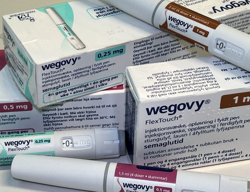 FILE PHOTO: Injection pens and boxes of Novo Nordisk's weight-loss drug Wegovy are shown in this photo illustration in Oslo, Norway, November 21, 2023. REUTERS/Victoria Klesty/File Photo