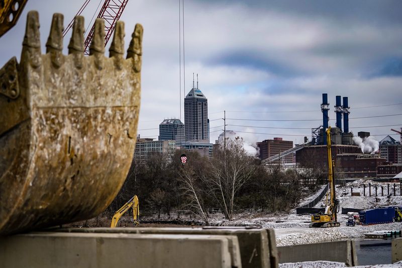 Construction continues on the Henry St. Bridge project next to the former Greenlawn Cemetery site where an Indy Eleven Stadium was once proposed, across from the new Elanco Headquarters and White River Greenway on Tuesday, Nov. 3, 2024, in Indianapolis.