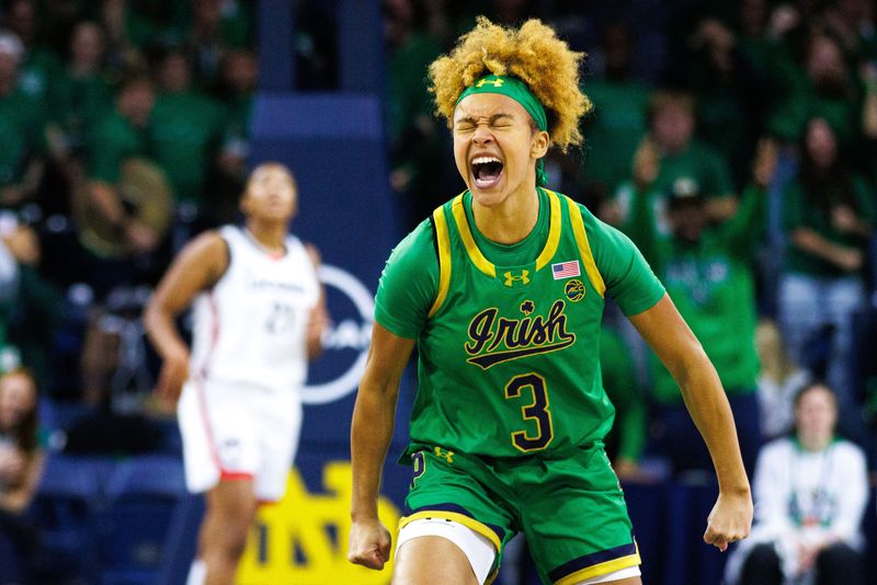 Notre Dame guard Hannah Hidalgo (3) celebrates scoring a three point shot during a NCAA women's basketball game between No. 8 Notre Dame and No. 2 UConn at Purcell Pavilion on Thursday, Dec. 12, 2024, in South Bend.