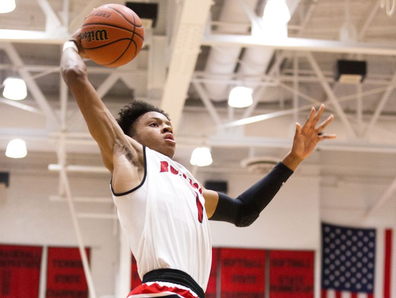 New Albany's Romeo Langford (1) dunks the ball during the game between New Albany and Evansville Bosse at New Albany High School.