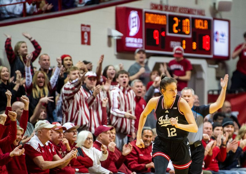 Indiana's Yarden Garzon (12) heads back up court after making a three-pointer during the Indiana versus UCLA women's game at Simon Skjodt Assembly Hall on Saturday, Jan. 4, 2025.