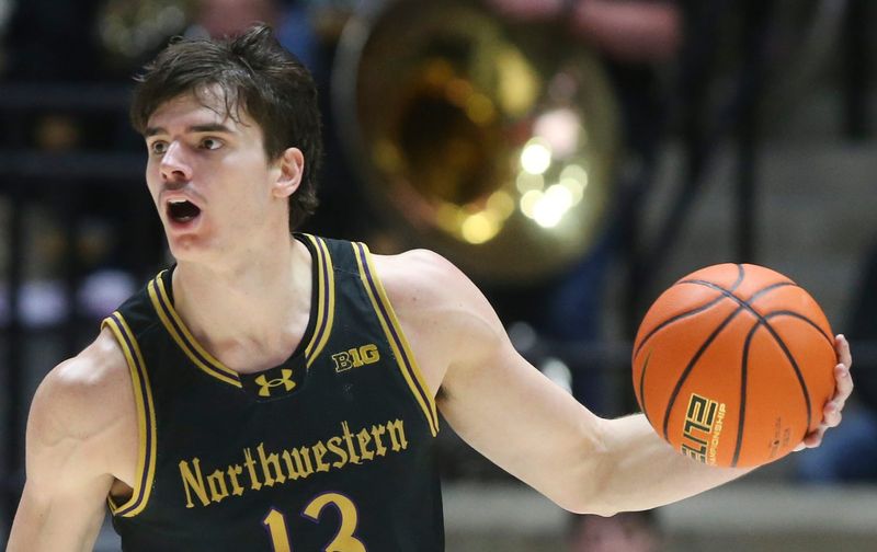 Northwestern Wildcats guard Brooks Barnhizer (13) drives to the basket Sunday, Jan. 5, 2025, during the NCAA men’s basketball game against the Purdue Boilermakers at Mackey Arena in West Lafayette, Ind.